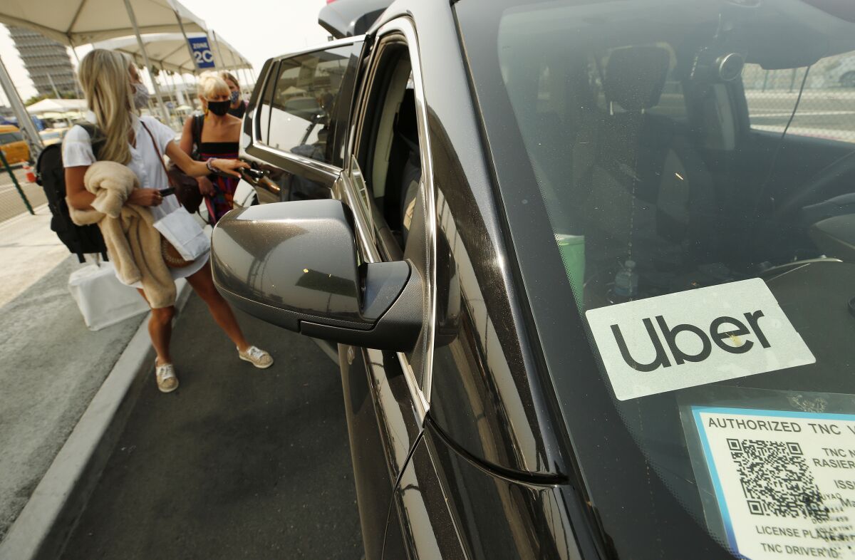 Car window with Uber logo sticker