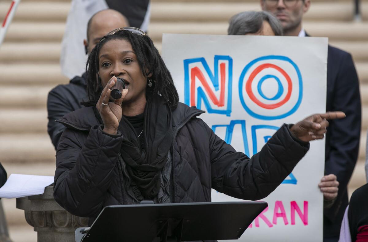 Buki Domingos, of the Racial Justice Coalition of San Diego, spoke at a press conference in Balboa Park in January 2020.