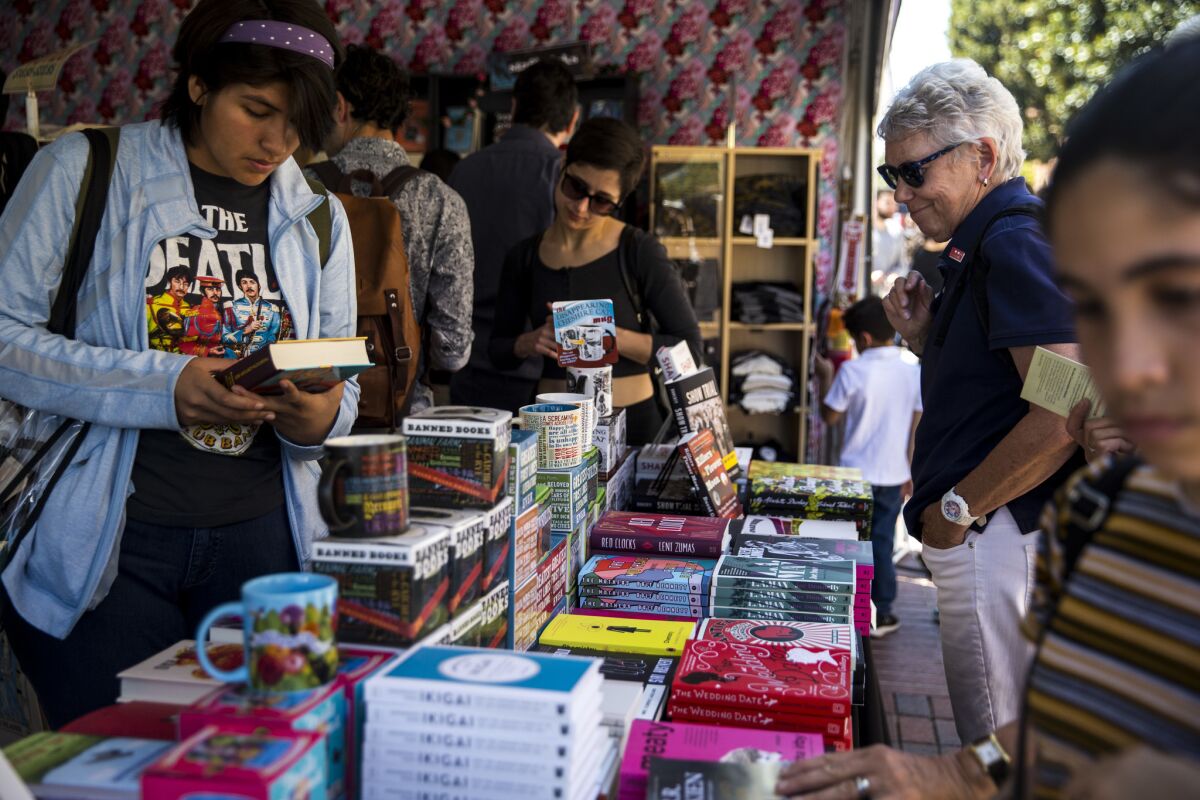 People browse books for sale during the 2018 Los Angeles Times Festival of Books.