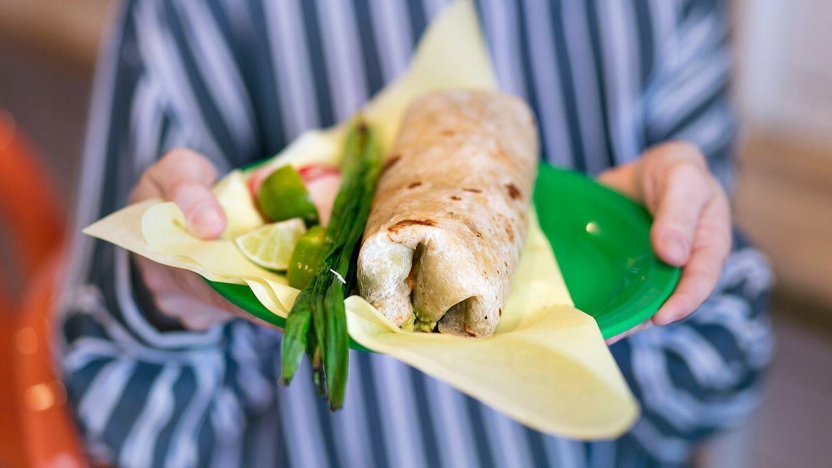 Diner shows off her Sonoratown burrito