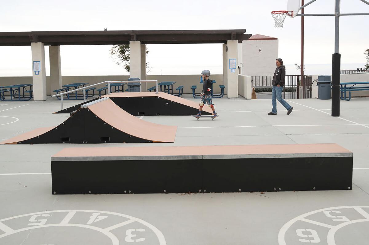 Taylor Marriner, 8, skateboards among the temporary ramps installed at the Laguna Beach Community and Recreation Center.