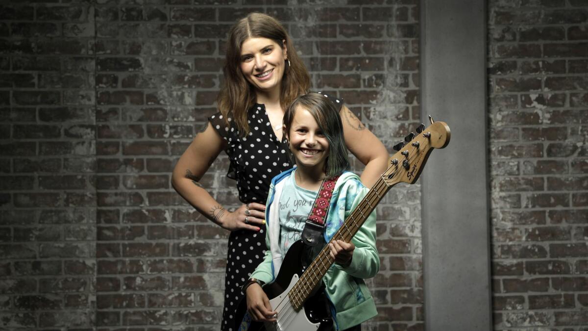 Bethany Cosentino of Best Coast, left, with 11-year-old Alia Briglia, who's learning to play bass.