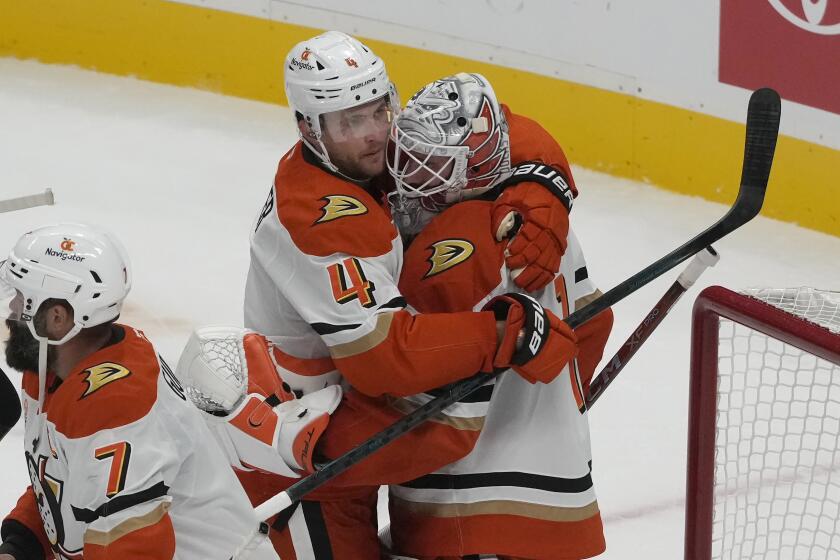 Anaheim Ducks defenseman Cam Fowler (4) celebrates with goaltender Lukas Dostal.