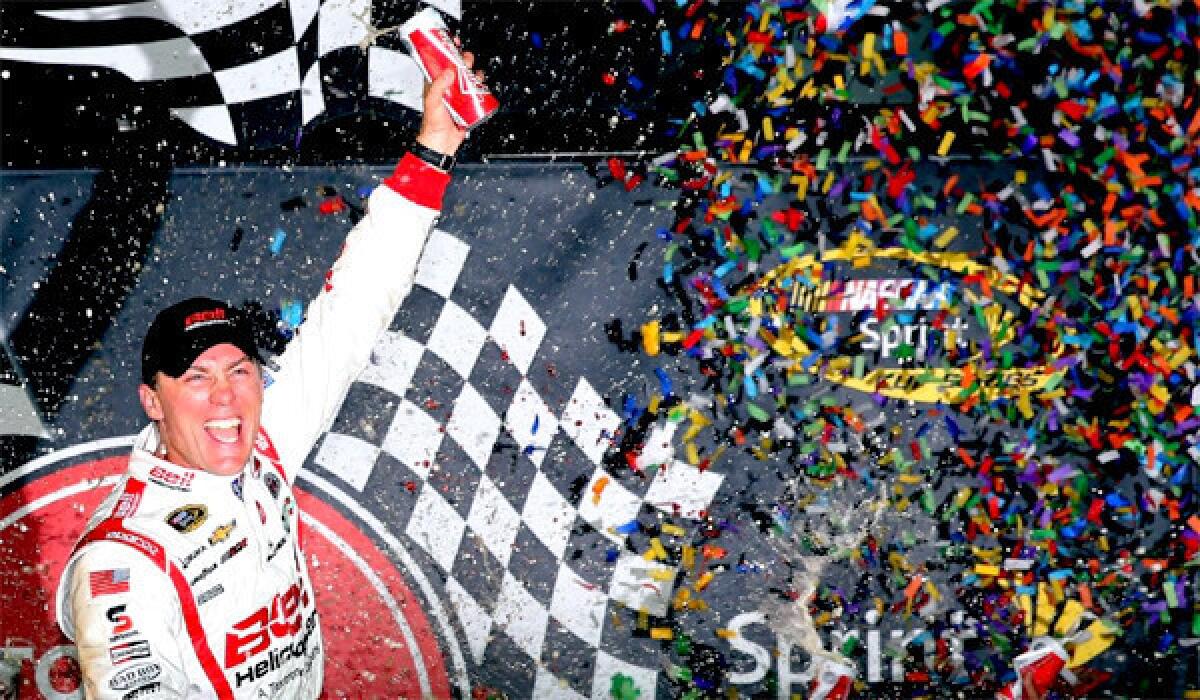 Kevin Harvick celebrates his victory at the NASCAR Sprint Cup Series Toyota Owners 400 at Richmond International Raceway.