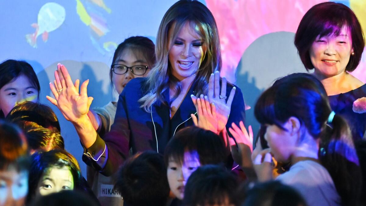 First Lady Melania Trump visits the Mori Building Digital Art Museum with Akie Abe, wife of Prime Minister Shinzo Abe, Sunday in Tokyo.