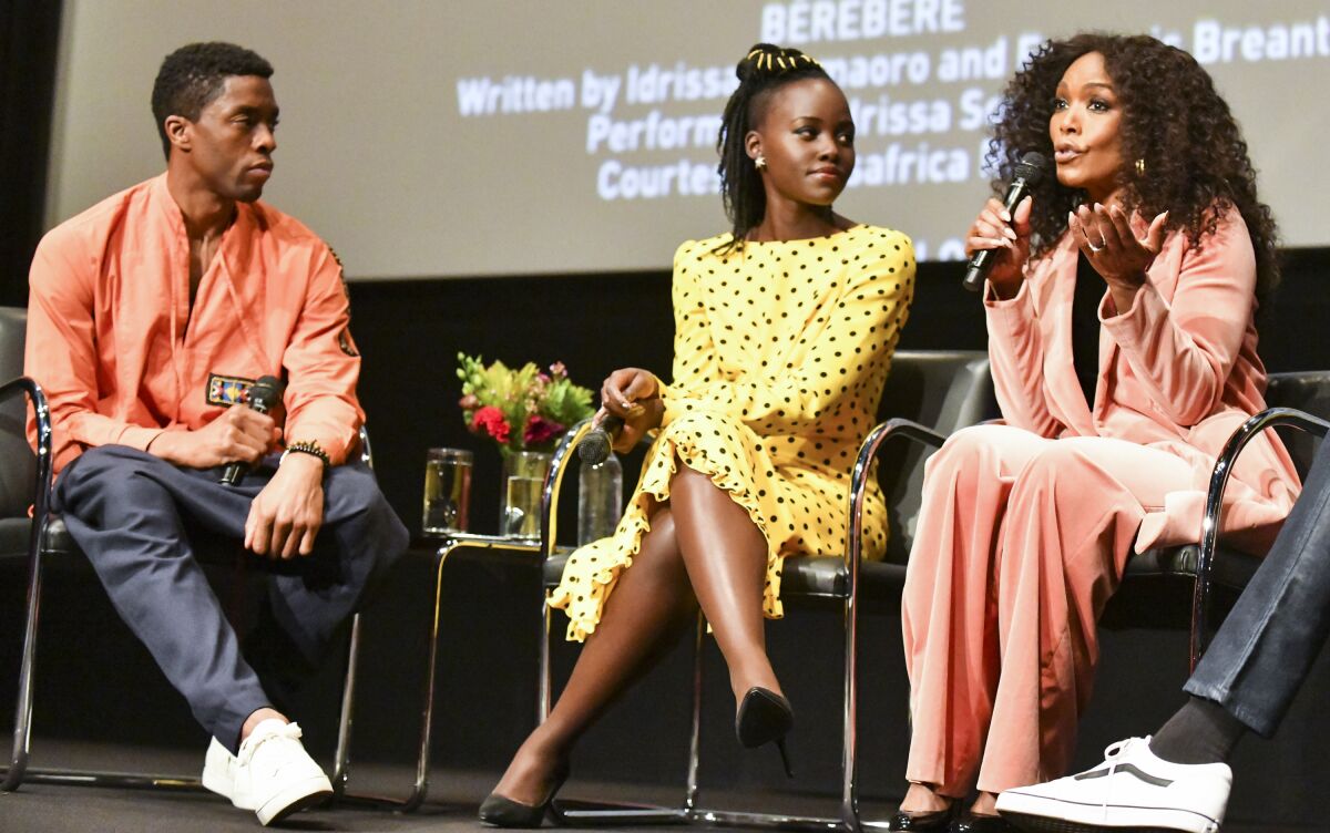 Chadwick Boseman, Lupita Nyong'o and Angela Bassett onstage at the Hammer Museum.