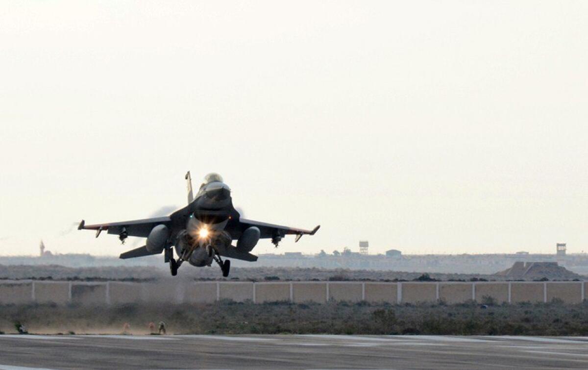 An Egyptian air force fighter jet lands at an undisclosed location in Egypt following airstrikes in Libya in this photo released by the Egyptian military on Feb. 16.
