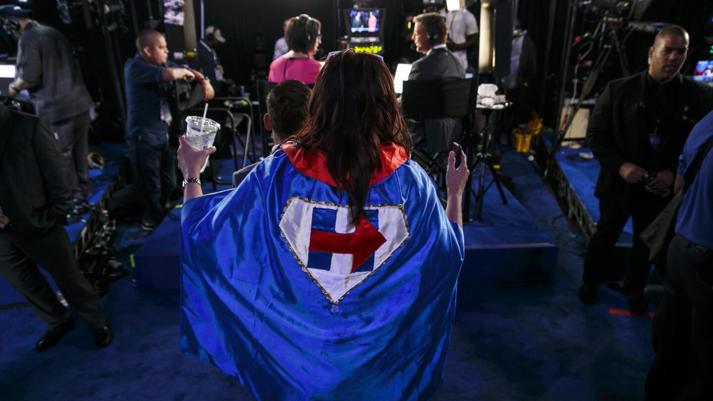 Kim Frederick, a delegate from Texas, wears a cape during the final day of the 2016 Democratic National Convention in Philadelphia.