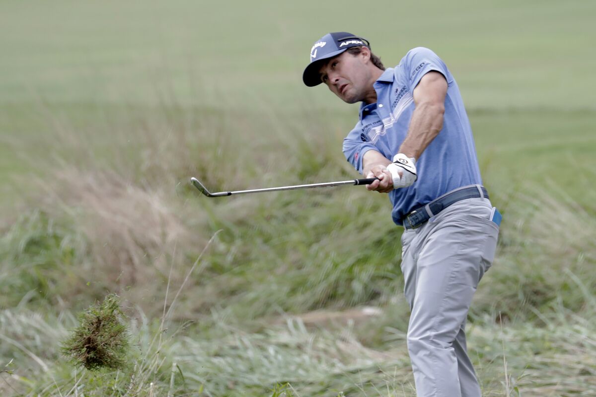 Kevin Kisner hits out of the rough on the eighth hole during the final round of the Wyndham Championship golf tournament at Sedgefield Country Club in Greensboro, N.C., Sunday, Aug. 15, 2021. (AP Photo/Chris Seward)