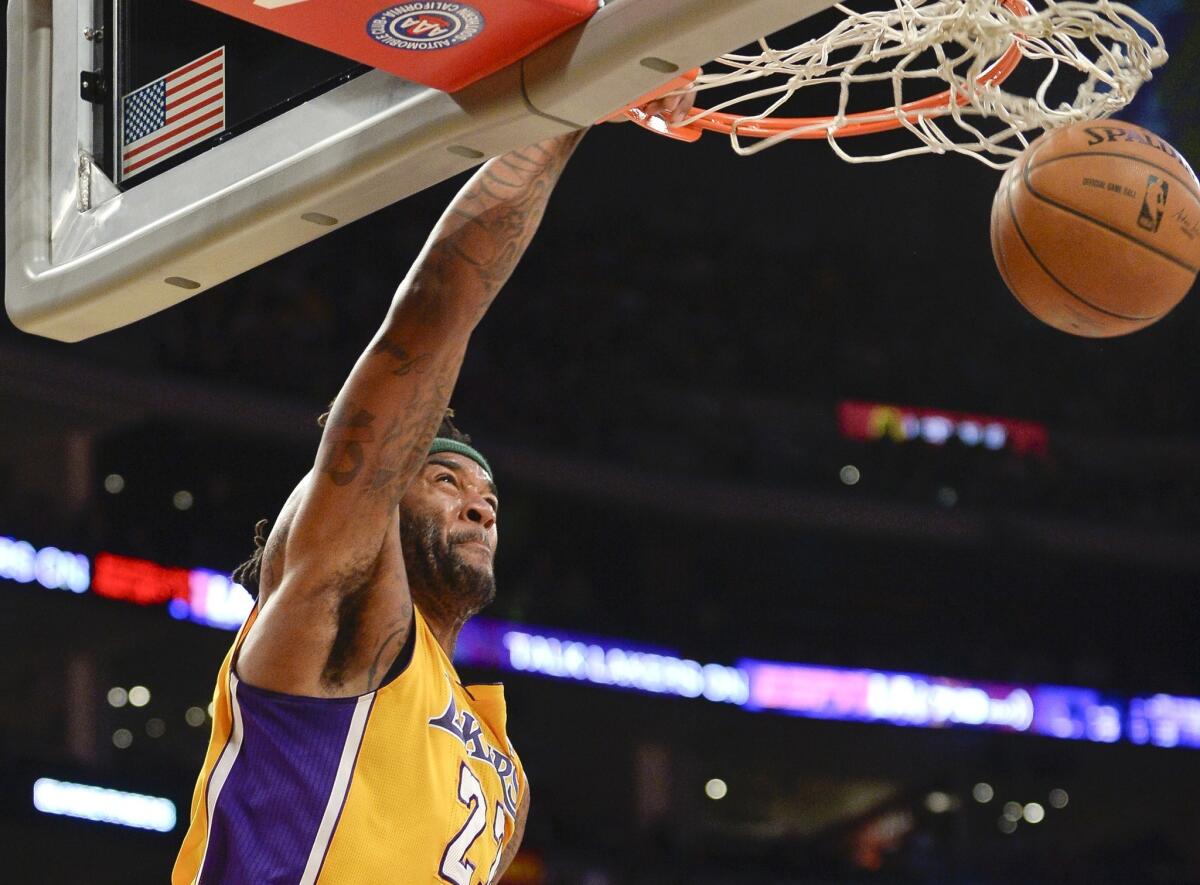 Lakers power forward Jordan Hill throws down a dunk against the Dallas Mavericks at Staples Center on April 4.