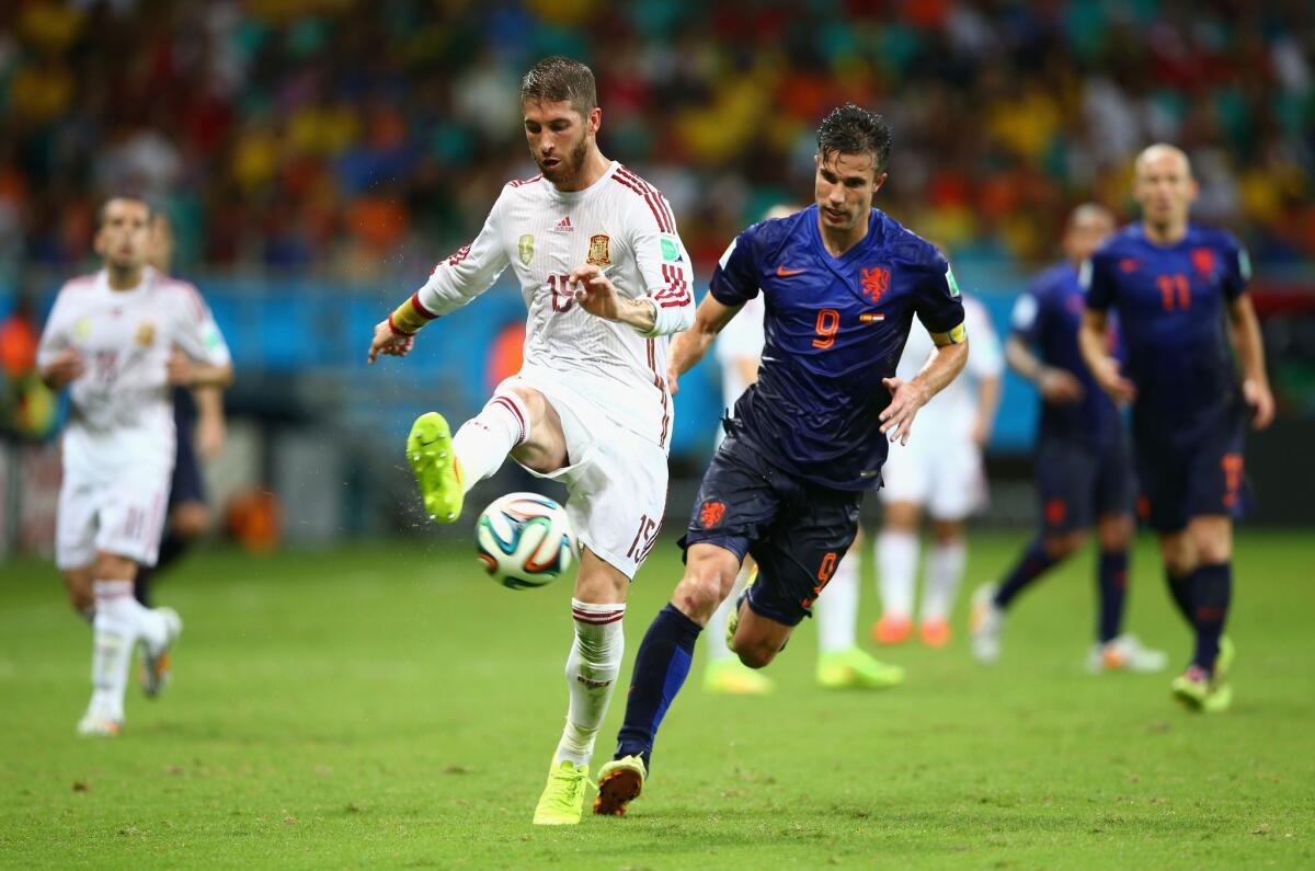 Spain's Sergio Ramos against the Netherlands' Robin van Persie during Friday's match.