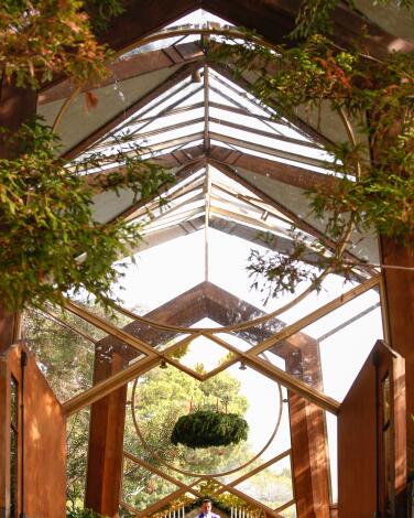 Wood and glass create triangular shapes inside Wayfarers Chapel.