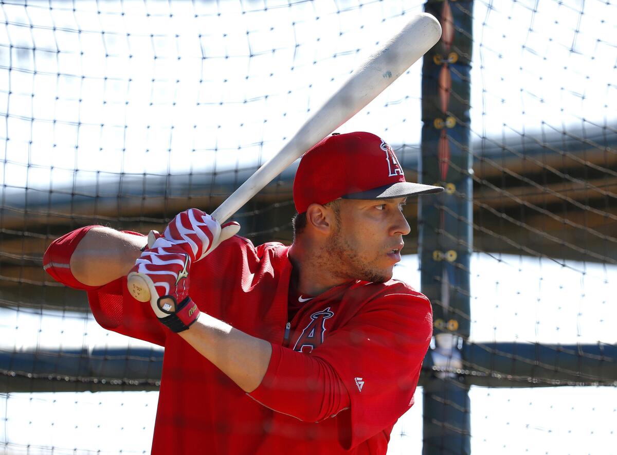 Angels shortstop Andrelton Simmons hits during a spring training batting practice in Tempe, Ariz.
