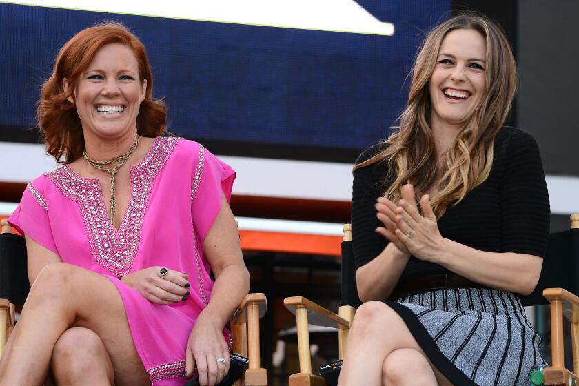 Alicia Silverstone, right, and "Clueless" costar Elisa Donovan attend the L.A. Film Festival's pre-festival outdoor screening of the 1995 comedy at L.A. Live on Tuesday.