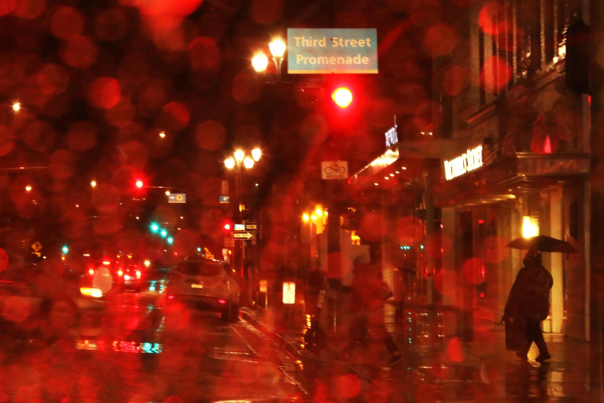 A pedestrian walks along Arizona Avenue in Santa Monica on Jan. 28.