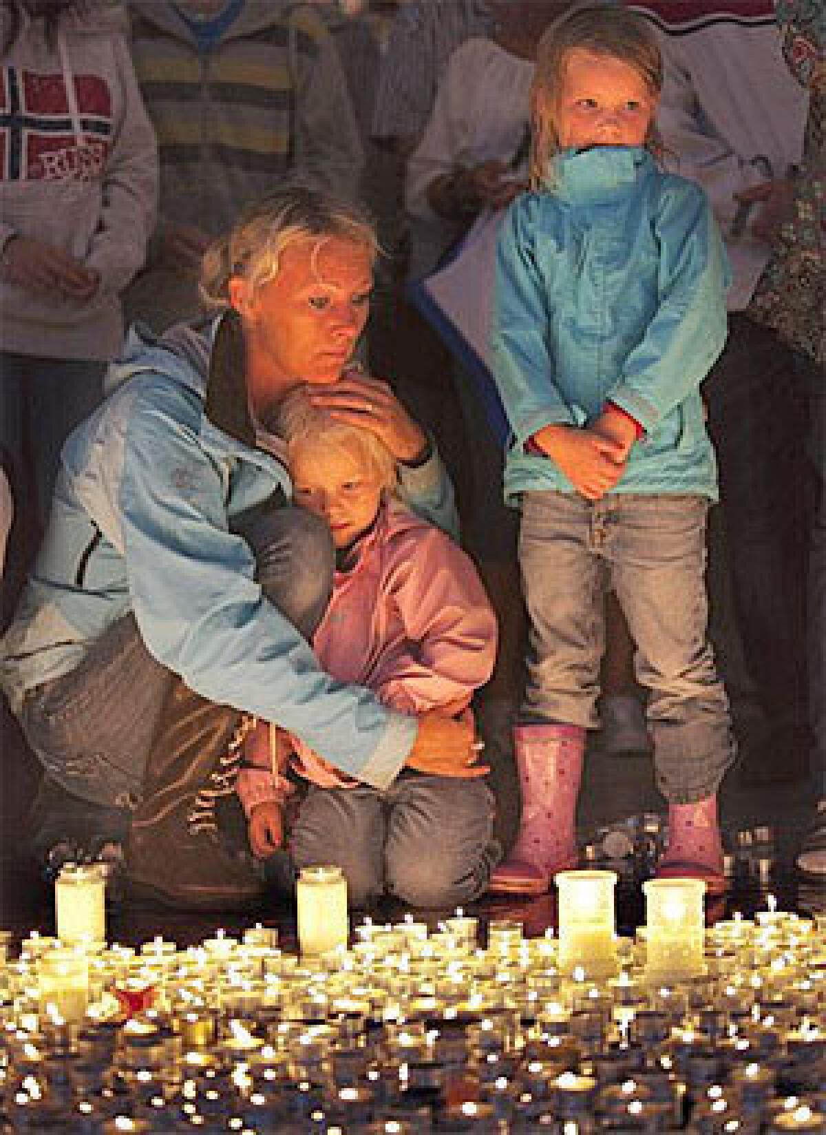 Friends and loved ones gather at the Oslo cathedral to mourn victims killed in a bombing and mass shooting in Norway in July 2011.