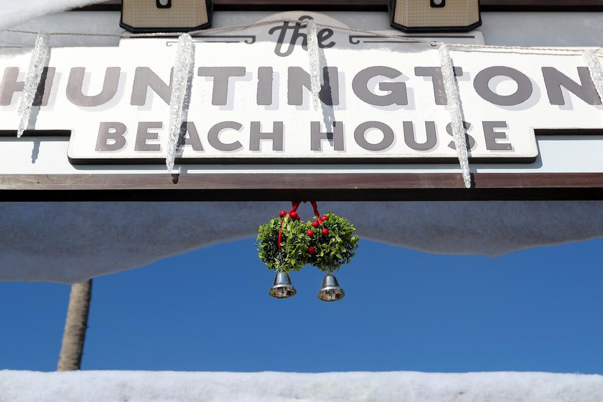 A double mistletoe with bells hangs at the main entrance to the Huntington Beach House.