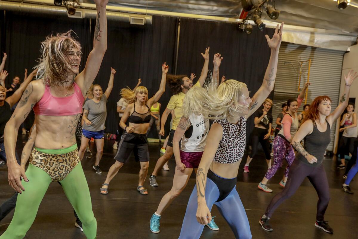 Emilia Richardson AKA Pony Sweat's, right, and C.J Miller hold a "radically noncompetitive" aerobics dance classes at Live Arts LA in Los Angeles.
