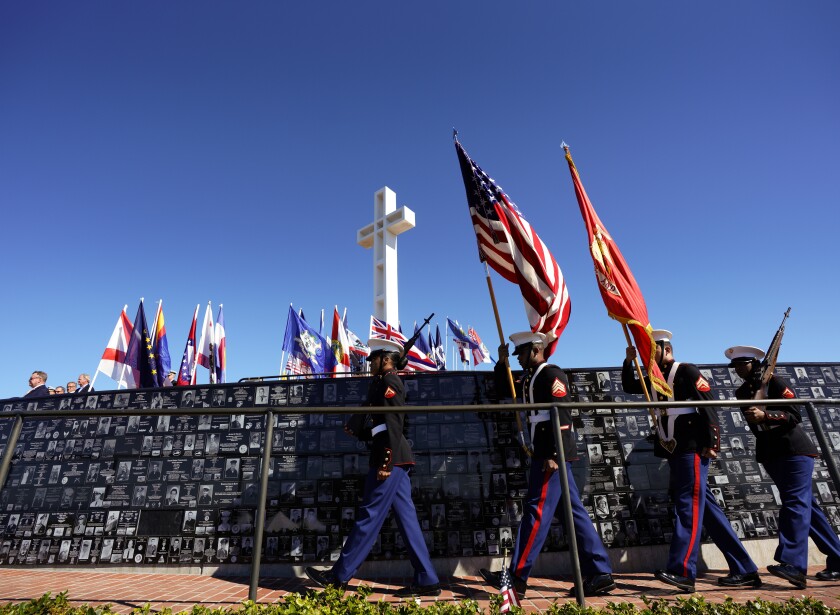 The color guard from Marine Corps Recruit Depot San Diego marches at the Mount Soledad National Veterans Memorial.