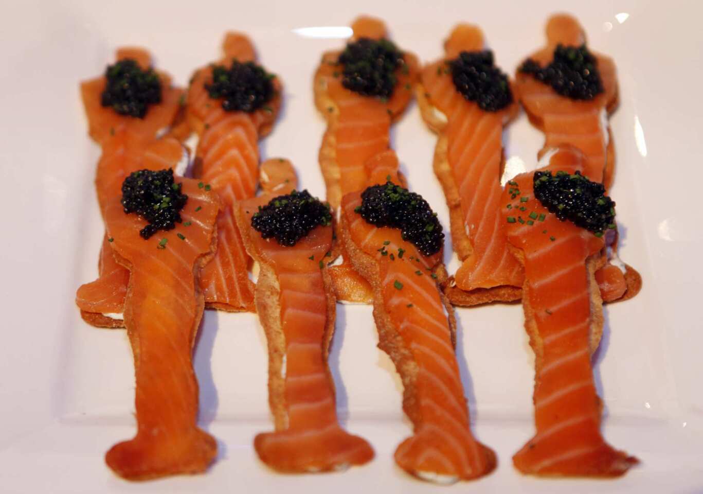 Smoked salmon is served on Oscar-shaped flatbread with caviar and crème fraiche.