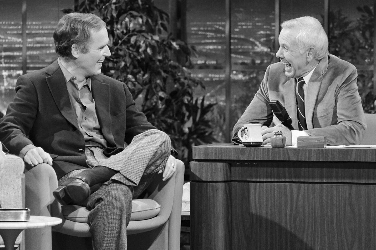Johnny Carson, right, interviews actor Charles Grodin 