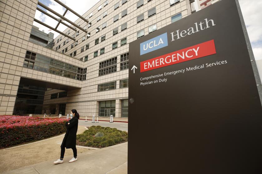 LOS ANGELES, CA - MARCH 17, 2020 Tents have been erected at the Saperstein Emergency Center entrance to the Ronald Regan UCLA Medical Center on the Westwood campus as hospitals are straining under coronavirus but the big wave hasn't hit yet as of March 17, 2020. (Al Seib / Los Angeles Times)