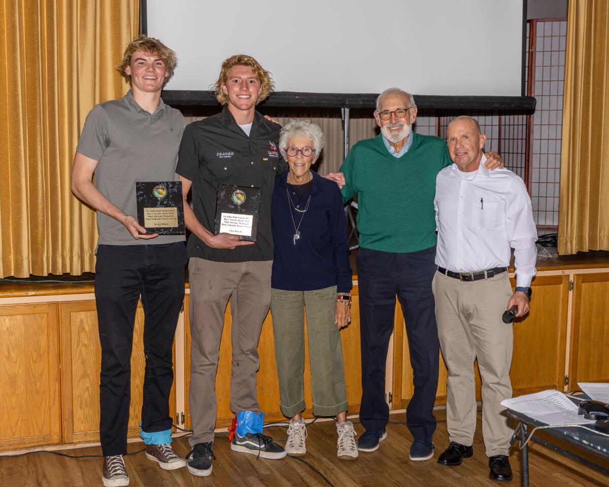 Kiefer Black and Finn Bugelli of La Jolla High School with Joyce and Dave Abrams and coach Tom Atwell