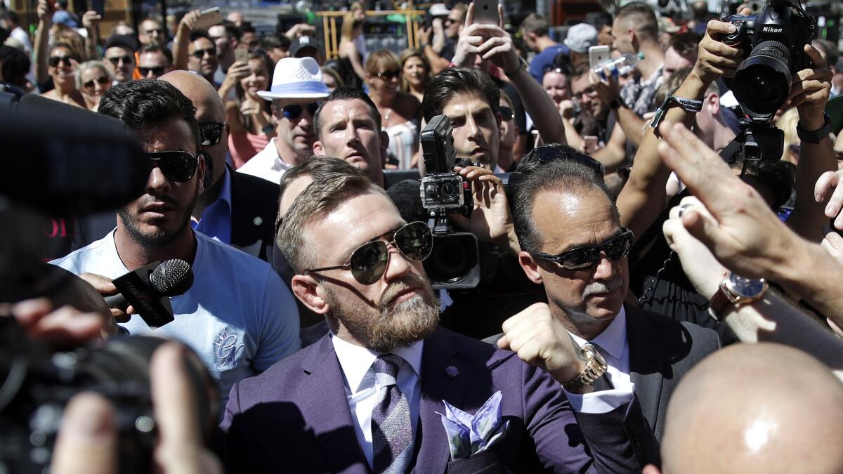 Conor McGregor received a considerably louder ovation than Floyd Mayweather Jr. when the fighters arrived at a publicity stop outside of T-Mobile Arena on Tuesday afternoon