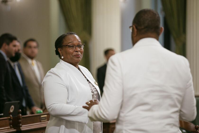 Assemblymember Lori D. Wilson, a Democrat from Suisun City, chats with legislators during session at the state Capitol in Sacramento on Aug. 22, 2022. Photo by Rahul Lal, CalMatters