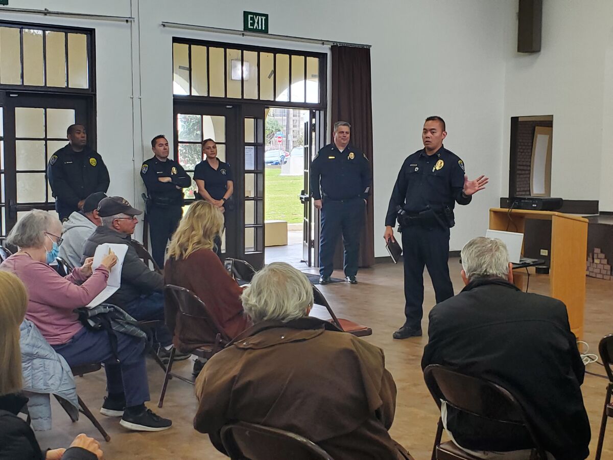 Representatives of the San Diego Police Department answer questions at a meeting at the La Jolla Recreation Center. 