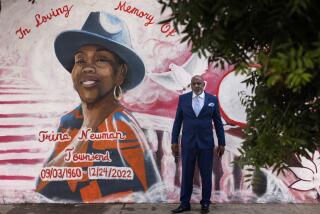 Los Angeles, CA - September 18: Curtis A. Townsend Sr., husband of Trina Newman, a retired minister, mother and grandmother, gathers at a mural in honor of his late wife near the location where she was killed by a speeding driver in South Central on Monday, Sept. 18, 2023 in Los Angeles, CA. (Jason Armond / Los Angeles Times)