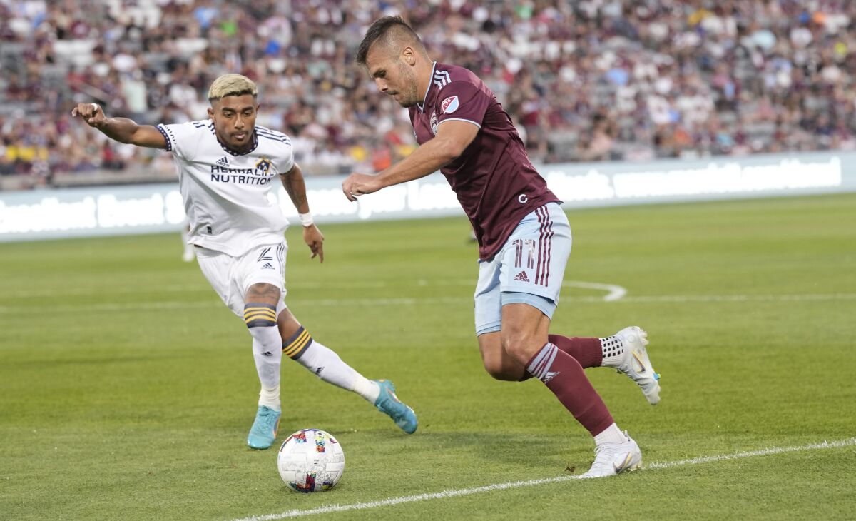 Galaxy defender Julian Araujo, left, looks to slow down Colorado Rapids forward Diego Rubio during the 2022 season.