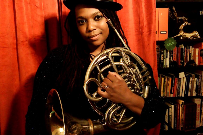 Kyra Sims and her French horn, Otto.