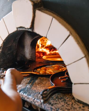 Breakfast is cooked in the pizza oven at Lodge Bread