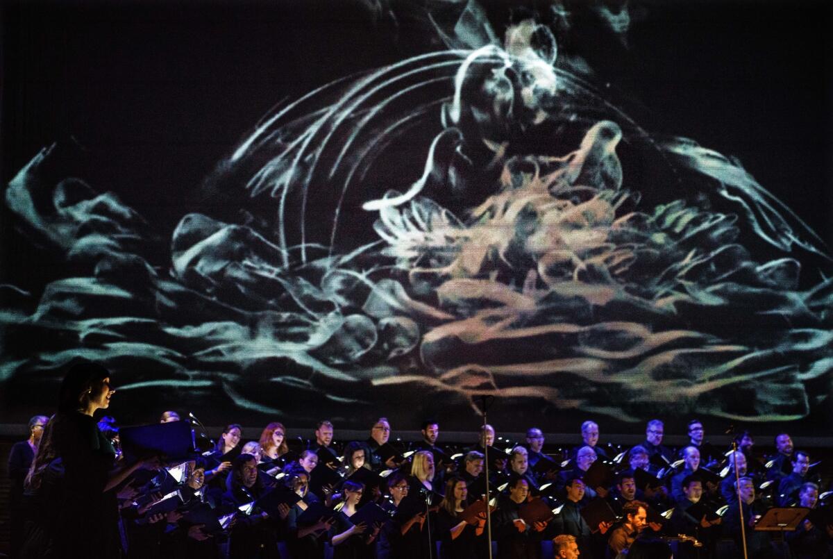 The Los Angeles Master Chorale sings "Israel in Egypt" with Kevork Mourad's art as a backdrop.