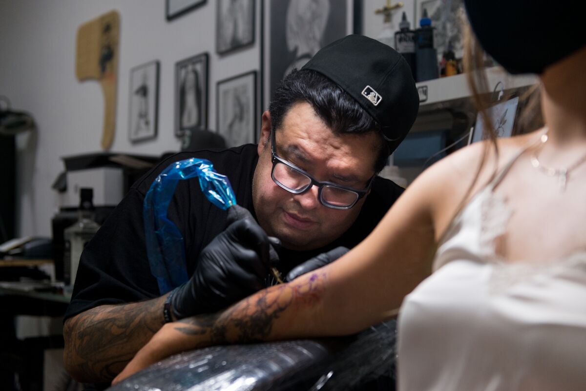 Juan Rodriguez, owner of FTF Tattoo, in Pacoima, California.