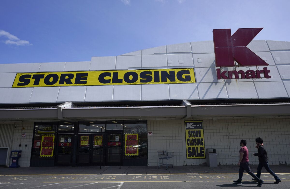 People walk into a Kmart in Avenel, N.J., Monday, April 4, 2022. When the New Jersey store closes its doors on April 16, it will leave only three remaining U.S. locations for the former retail powerhouse. It's a far cry from the chain's heyday in the 1980s and ‘90s when it had more than 2,000 stores and sold product lines endorsed by Martha Stewart and former “Charlie's Angel” Jaclyn Smith. (AP Photo/Seth Wenig)