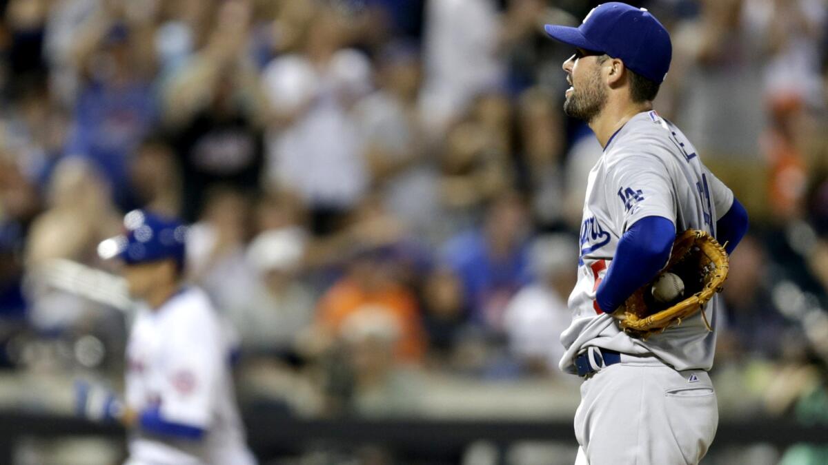 Dodgers starter Zach Lee waits on the mound as Mets second baseman Kelly Johnson heads toward home plate after hitting a home run in the fifth inning Saturday night in New York.