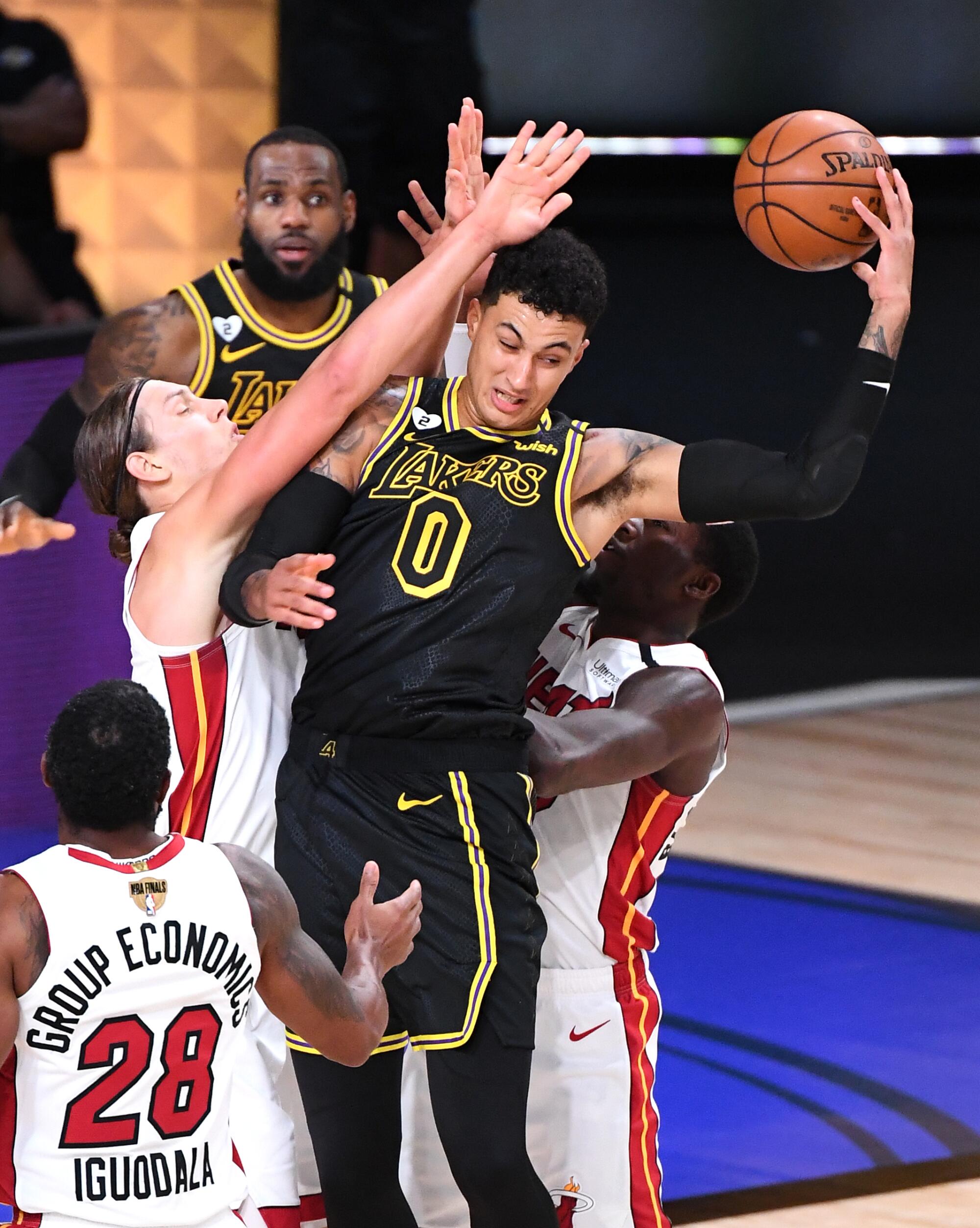 Lakers forward Kyle Kuzma tries to pass under pressure during Game 2 of the NBA Finals on Friday.