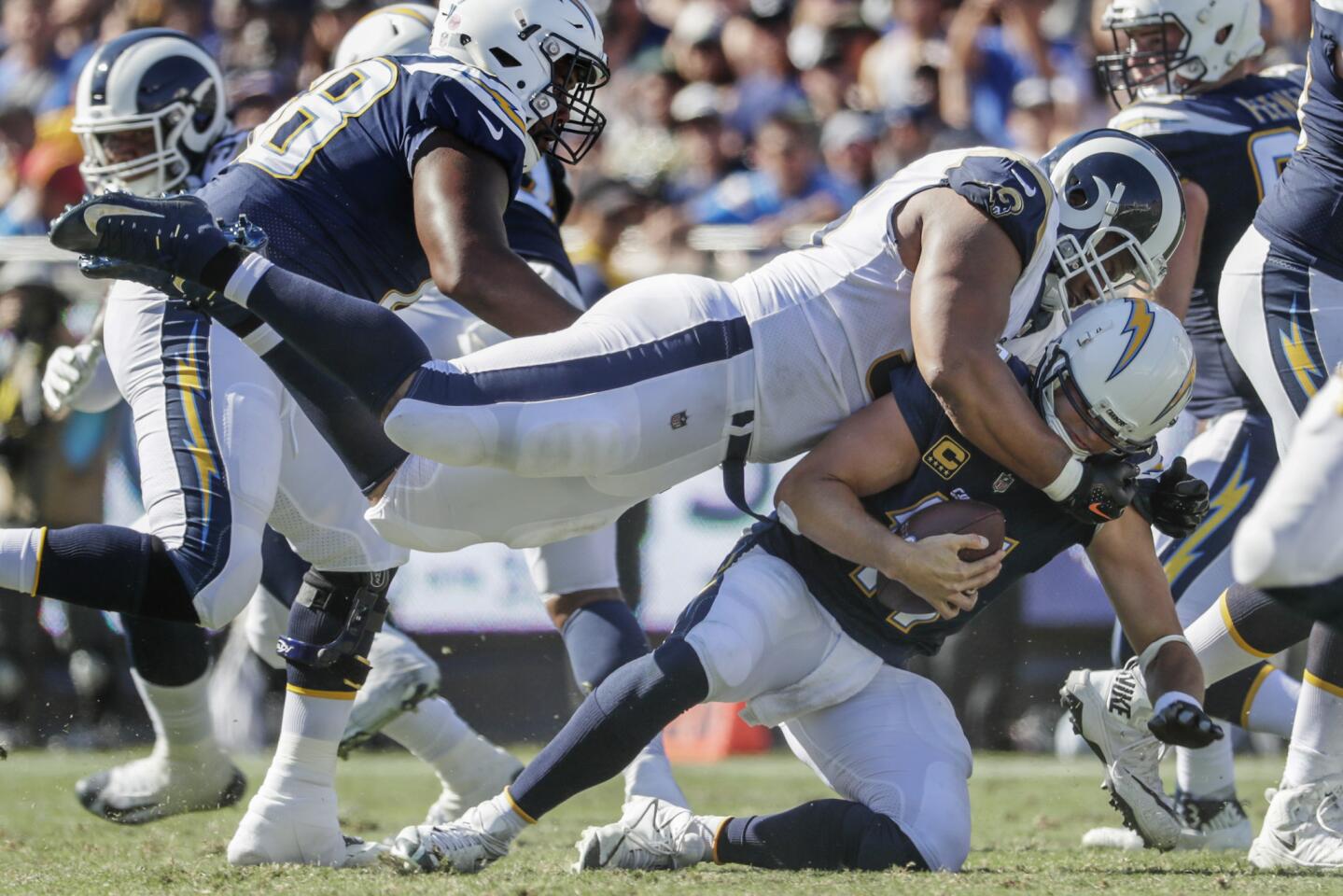 Chargers quarterback Philip Rivers is sacked by Rams defensive lineman Ndamukong Suh during a third quarter drive on Sept. 23