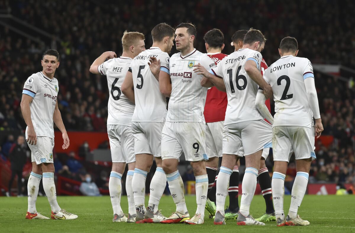 Burnley players react during the English Premier League soccer match between Manchester United and Burnley at Old Trafford in Manchester, England, Thursday, Dec. 30, 2021. (AP Photo/Rui Vieira)
