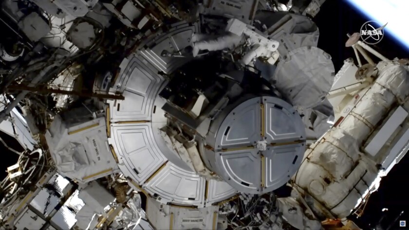 In this image taken from NASA video NASA astronaut Jessica Meir works to finish upgrading the International Space Station's power grid, Wednesday, Jan. 15, 2020. NASA is in the midst of replacing decades-old nickel-hydrogen batteries outside the sprawling space station with more powerful, longer-lasting lithium-ion batteries. The batteries are part of the station's solar power network, keeping everything running when the outpost is on the night side of Earth. It was the second pairing of Meir and Christina Koch outside the orbiting lab. (NASA via AP)