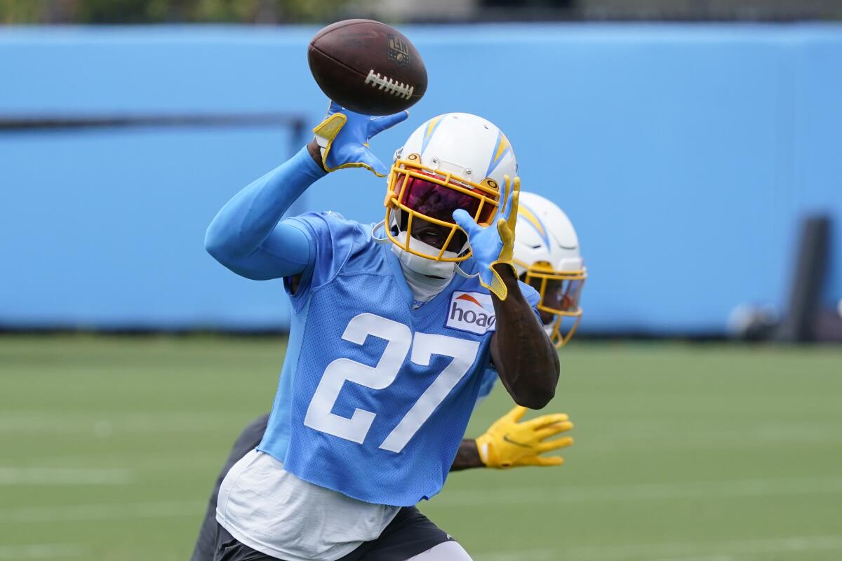 Chargers cornerback J.C. Jackson makes a catch on June 14 in Costa Mesa