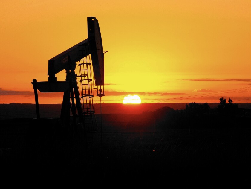 An oil well in North Dakota. OPEC and other producers have agreed to extend output cuts.