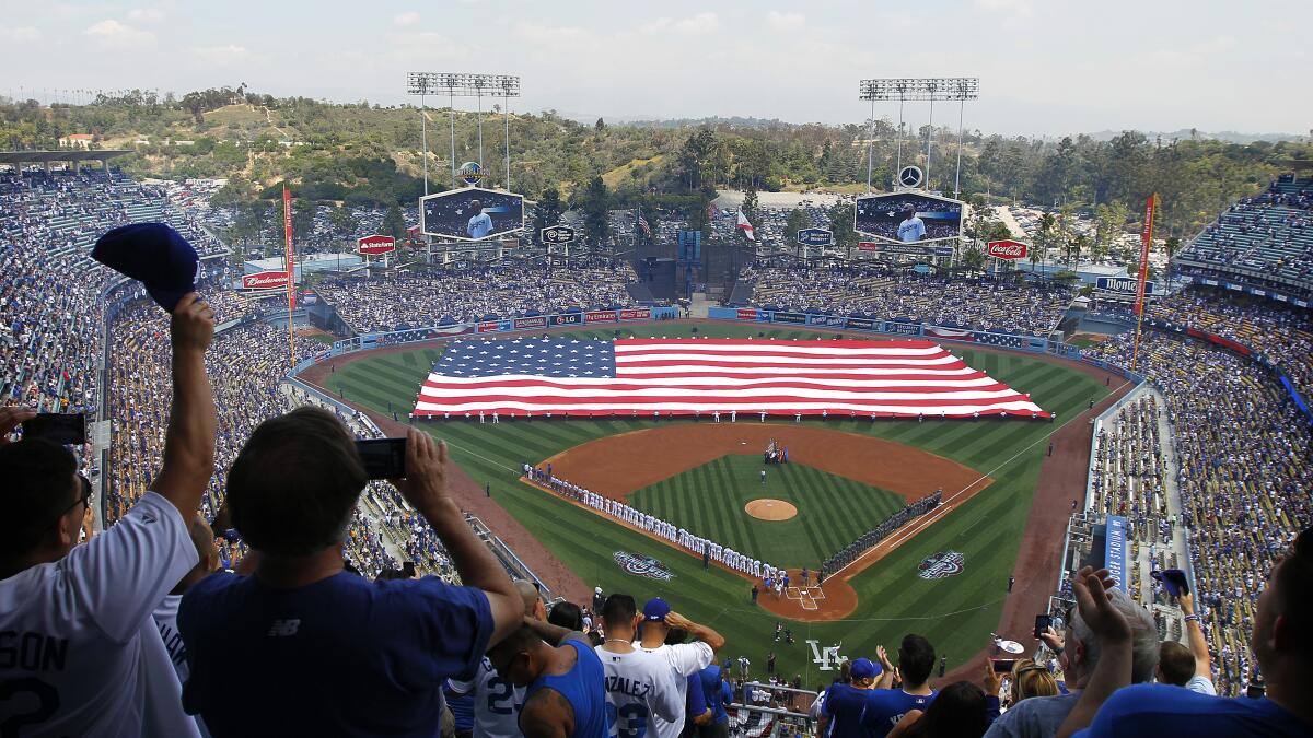 Dodgers' Dave Roberts spends a 'surreal' opening day at home - Los