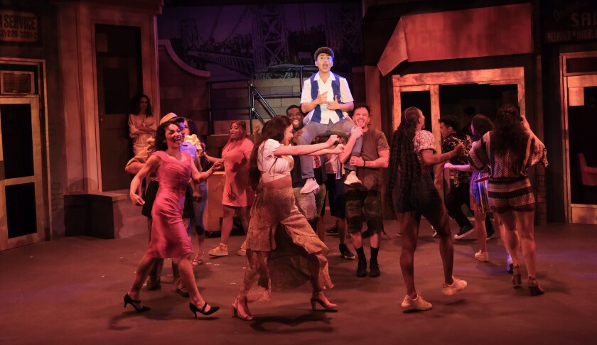 Sebastian Montenegro as Usnavi, top, leads the cast of San Diego Musical Theatre's "In the Heights."