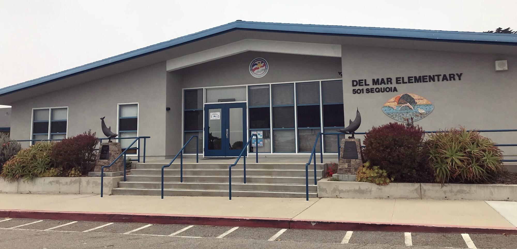 A single-story building bearing the words "Del Mar Elementary"