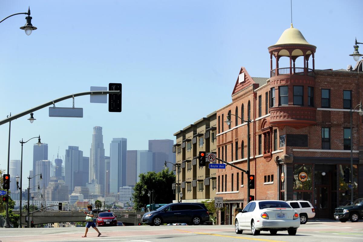 A view of downtown Los Angeles, at left, can be seen from the Boyle Hotel, which is now an affordable housing building.
