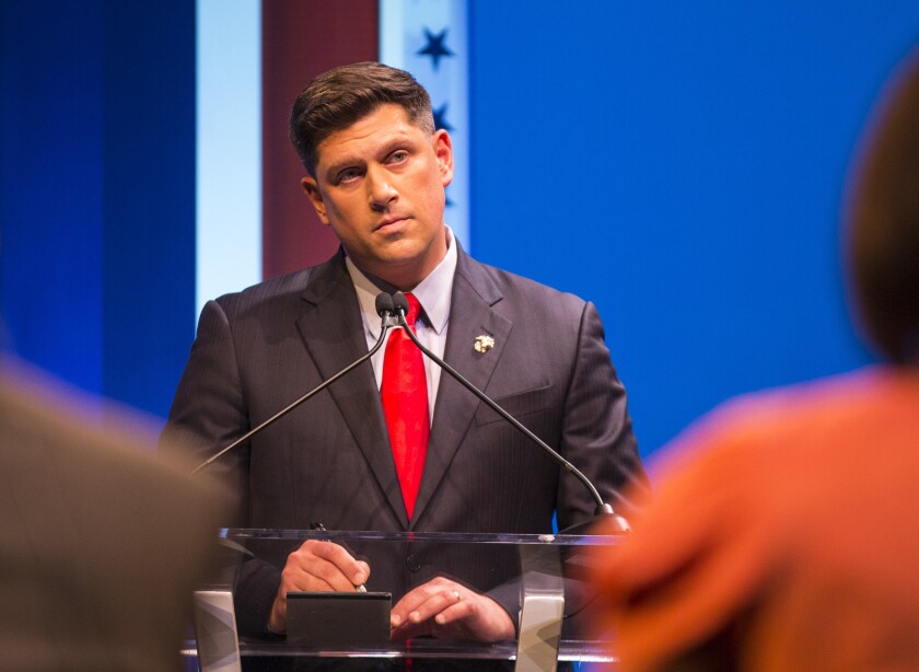 FILE - Republican U.S. Senate candidate Kevin Nicholson stands at his podium during his debate with fellow candidate Leah Vukmir, Thursday, July 26, 2018, in Milwaukee. Nicholson, a former Marine and losing candidate for U.S. Senate is running for governor in Wisconsin, Thursday, Jan. 27, 2022, setting up what is expected to be a costly and contentious Republican primary. (Tyger Williams/Milwaukee Journal-Sentinel via AP, File)