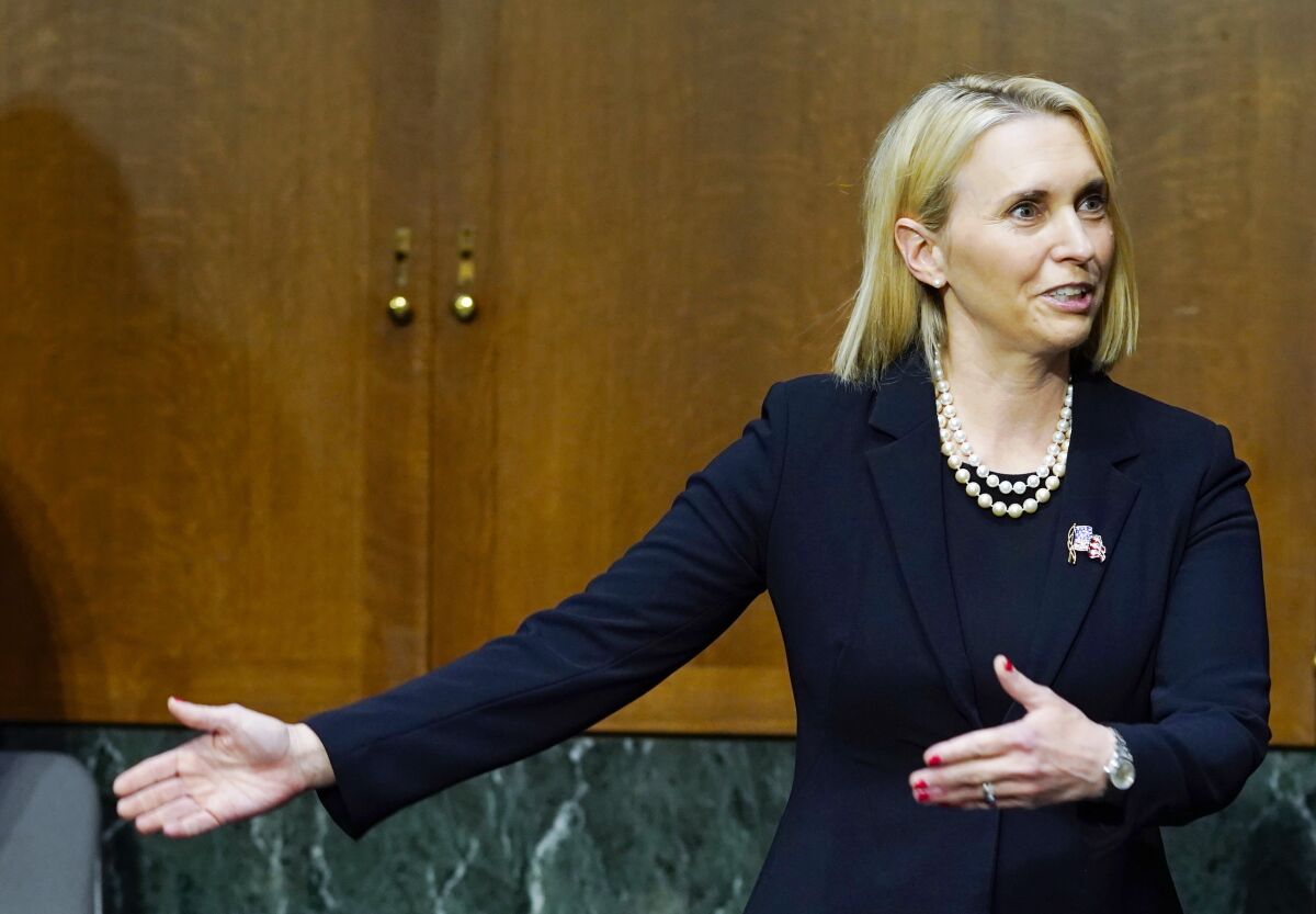 Bridget Brink, nominated to be U.S Ambassador to Ukraine, talks before she testifies before a Senate Foreign Relations Committee confirmation hearing, Tuesday, May 10, 2022, on Capitol Hill in Washington. (AP Photo/Mariam Zuhaib)